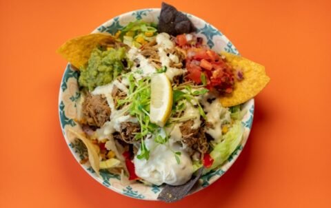 lettuce, mexican rice, mexican beans, grilled corn, capsicum and your choice of protein topped with sour cream, guacamole, pico de Gallo, lime + cilantro dressing & corn chips. Vegetarian & Vegan - Roasted cauliflower, pumpkin & quinoa