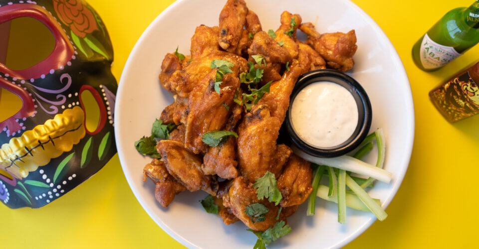 OTB Fried chicken wings tossed in maple chipotle glaze served with ranch sauce.